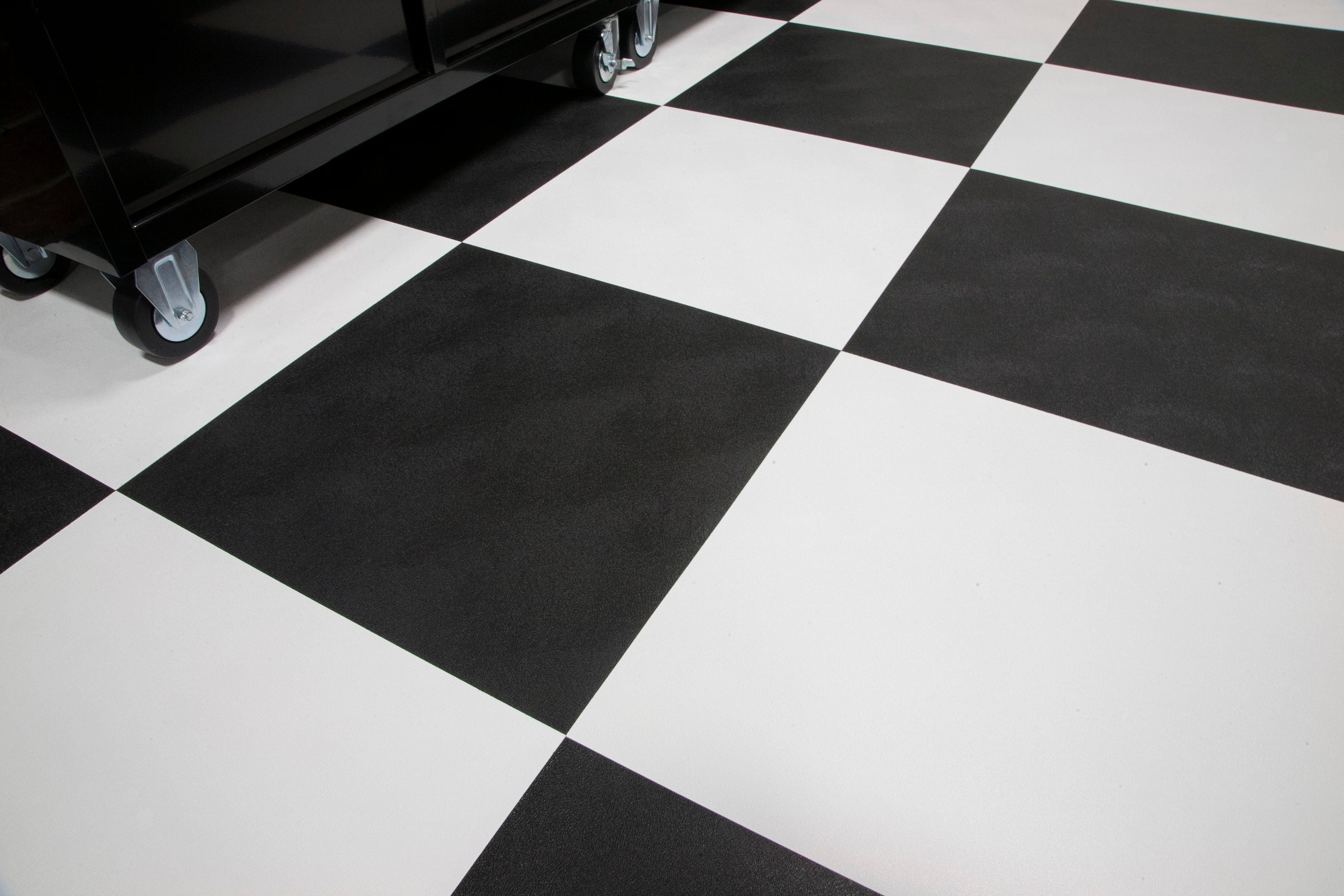 A single green leaf against a white background.