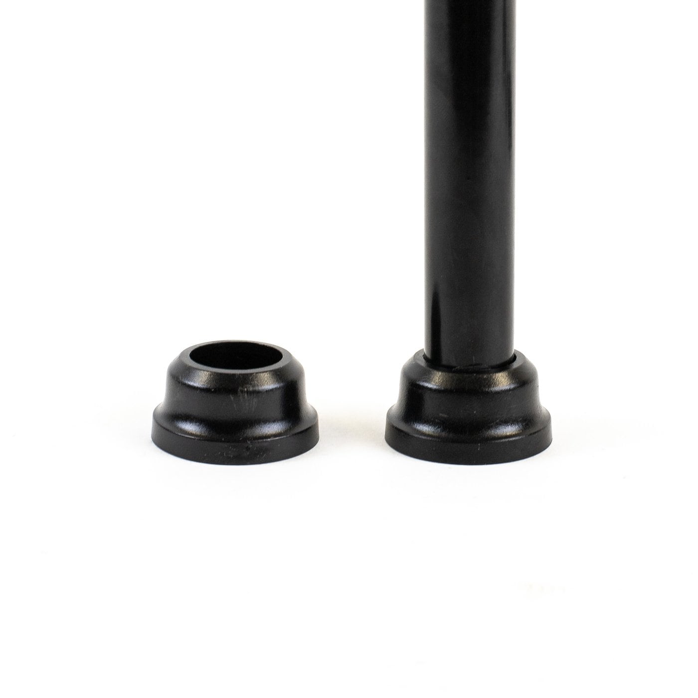 A single green leaf against a white background.