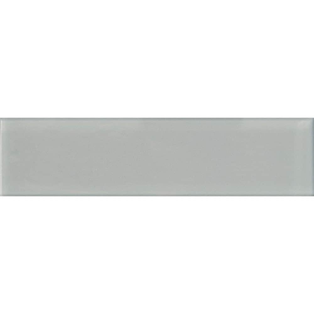 A single green leaf against a white background.