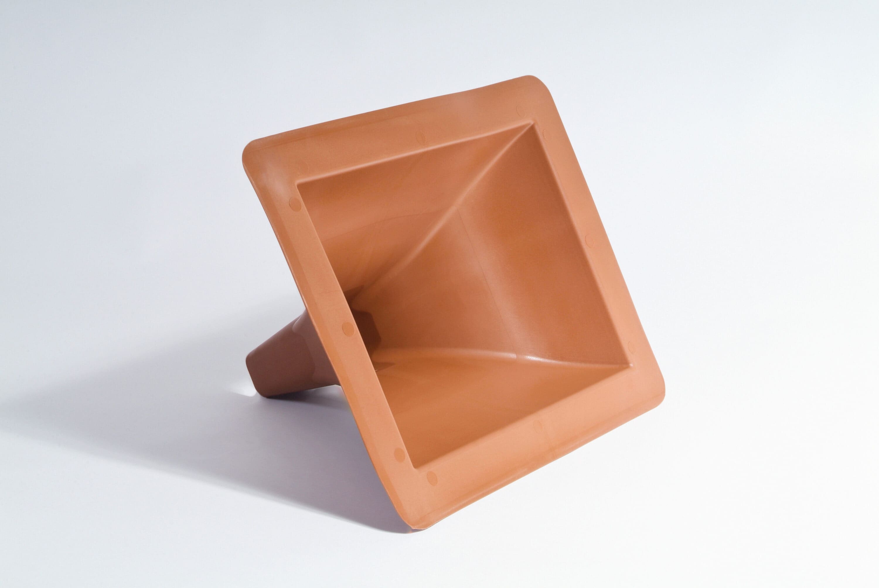 A single green leaf against a white background.