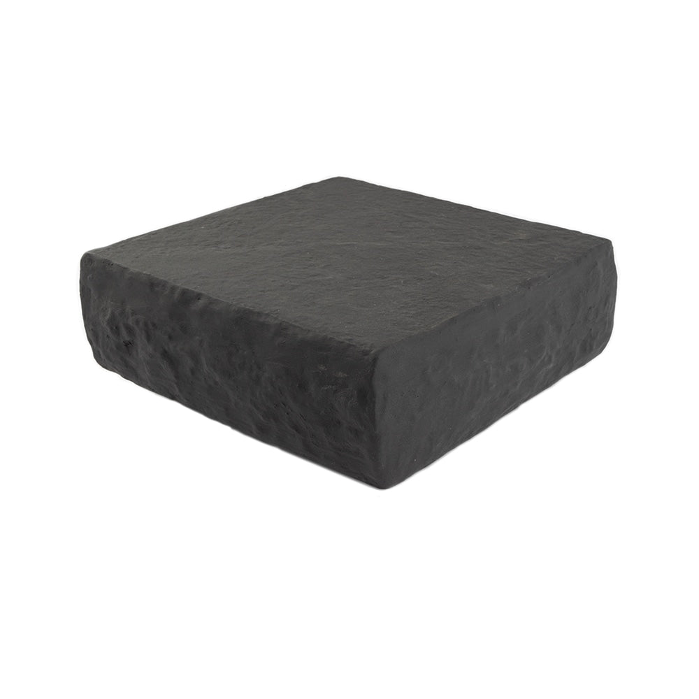 A single green leaf against a white background.