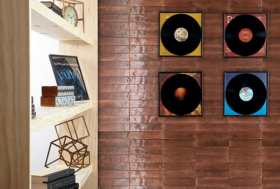 A single green leaf against a white background.