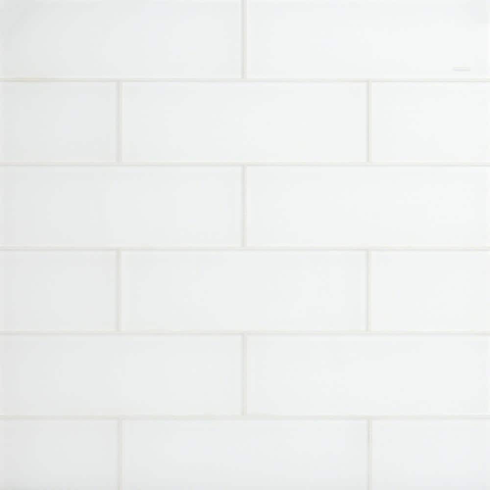 A single green leaf against a white background.