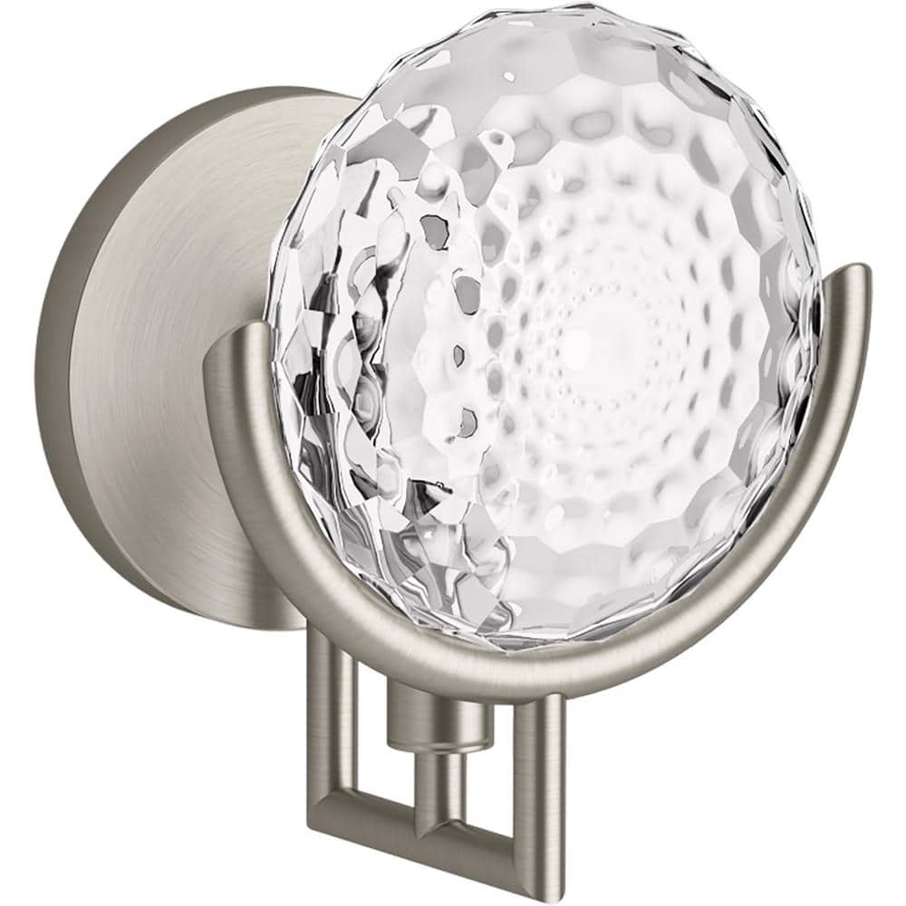 A single green leaf against a white background.