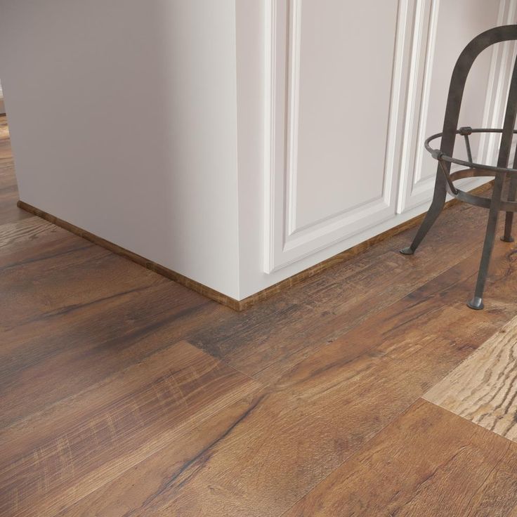 A single green leaf against a white background.