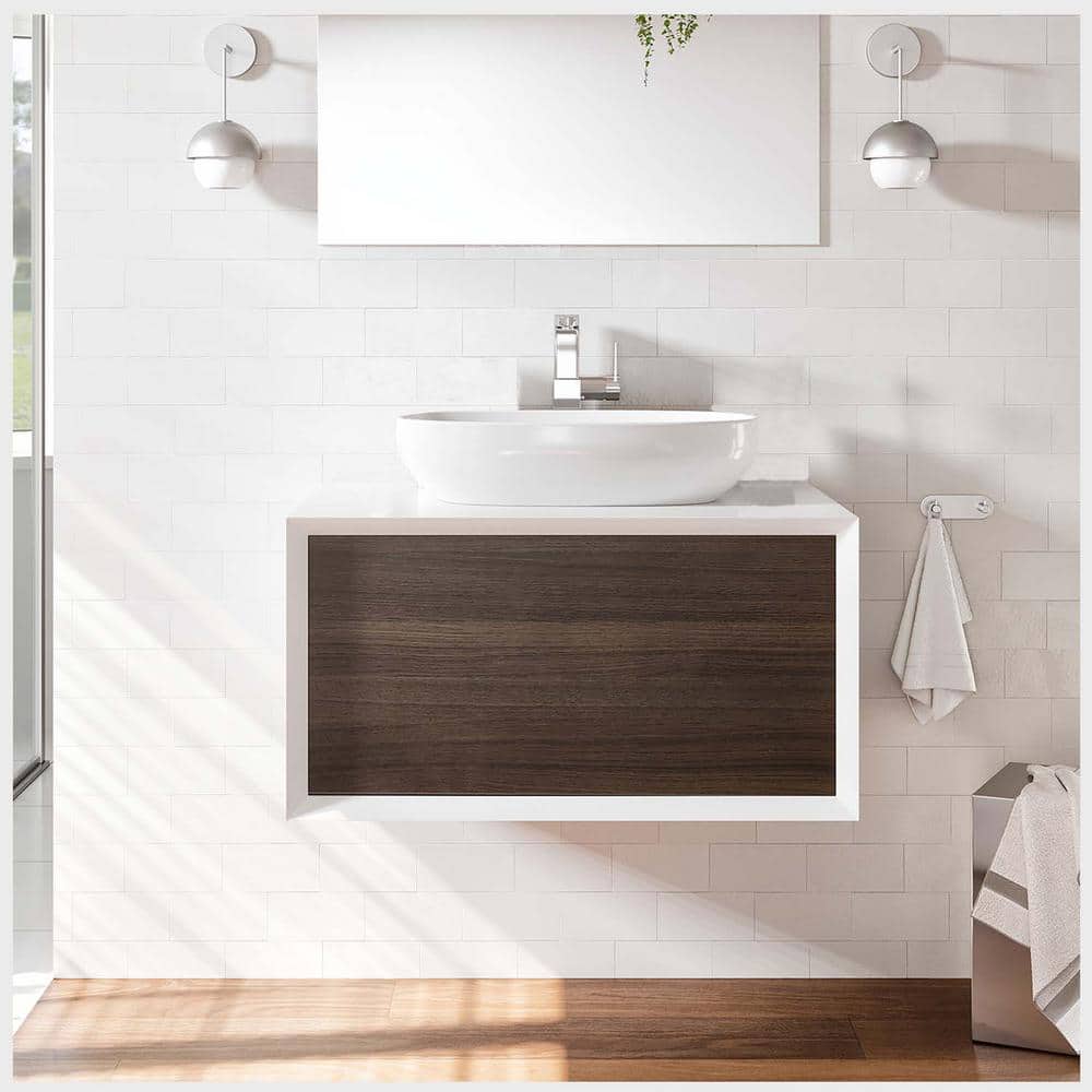 A single green leaf against a white background.