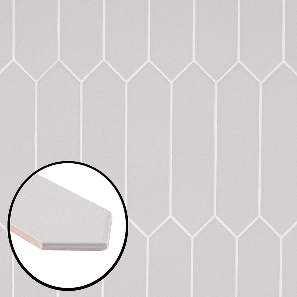 A single green leaf against a white background.