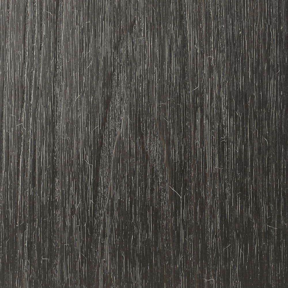 A single green leaf against a white background.