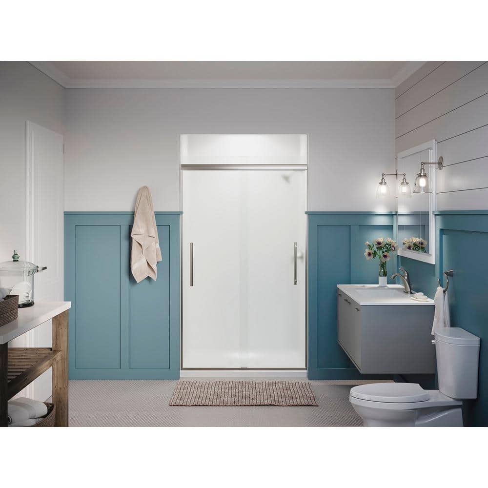 A single green leaf against a white background.