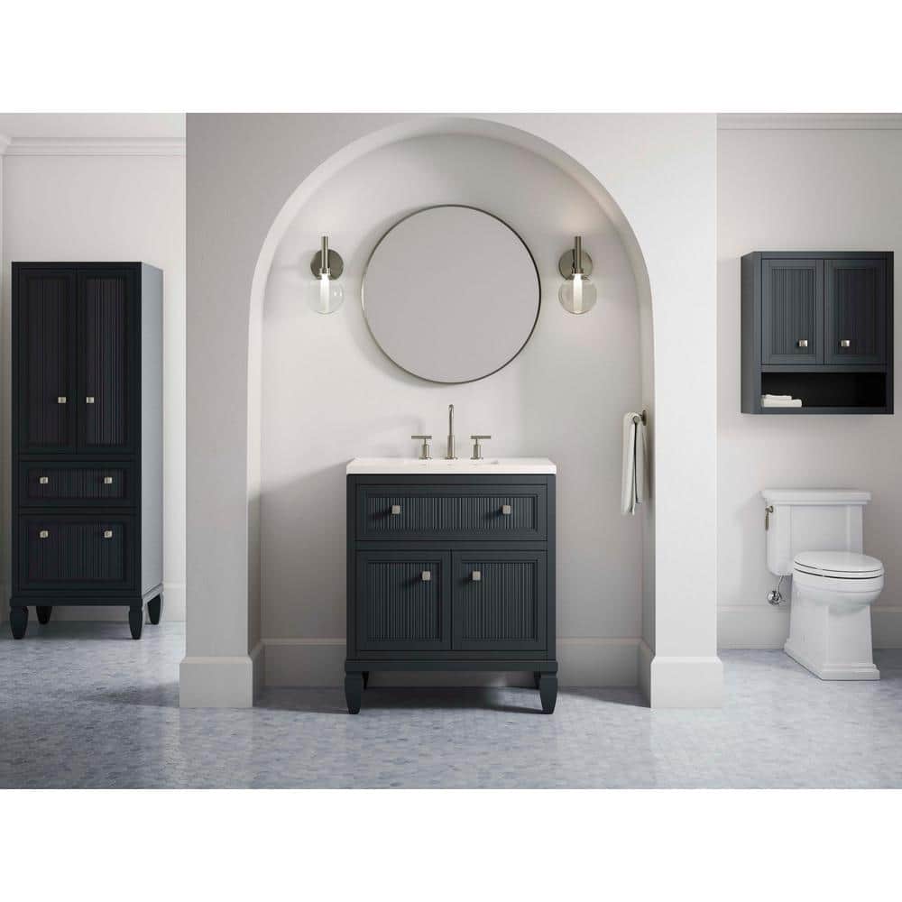 A single green leaf against a white background.