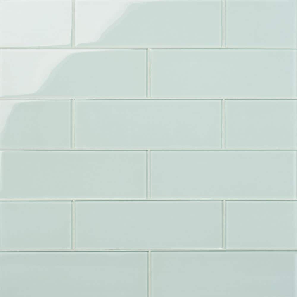 A single green leaf against a white background.