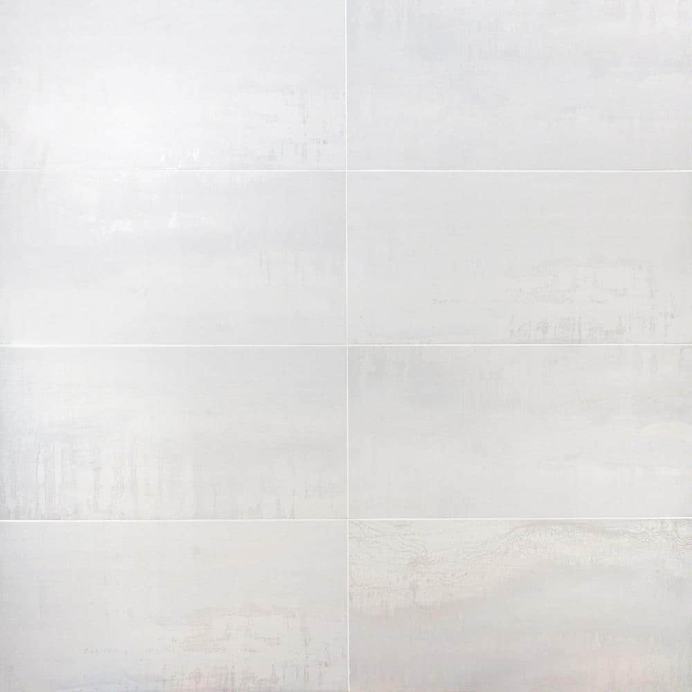 A single green leaf against a white background.