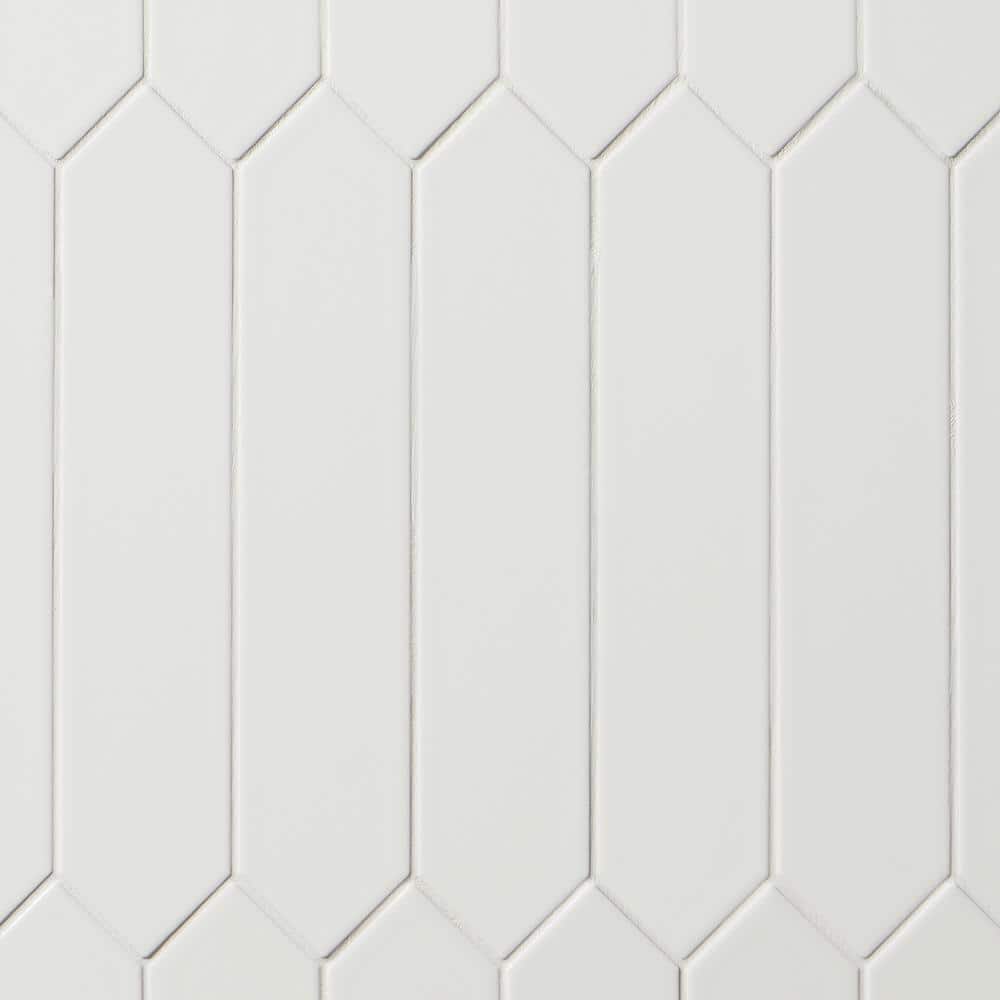 A single green leaf against a white background.