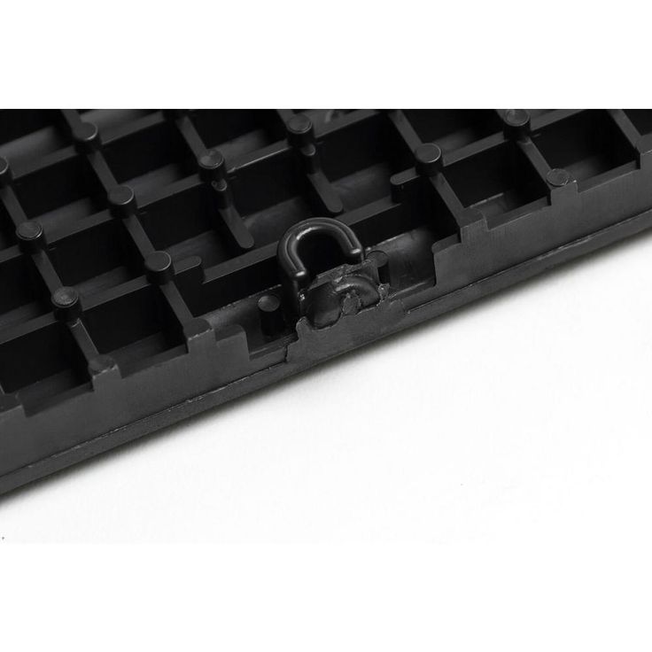 A single green leaf against a white background.