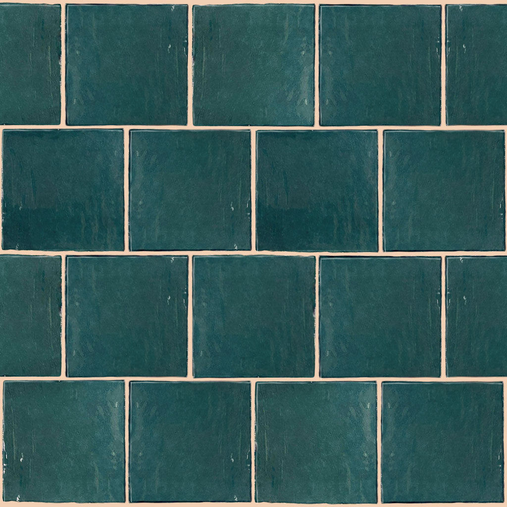 A single green leaf against a white background.