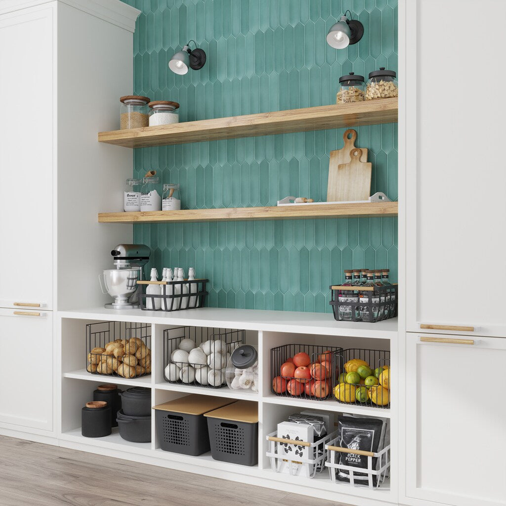 A single green leaf against a white background.