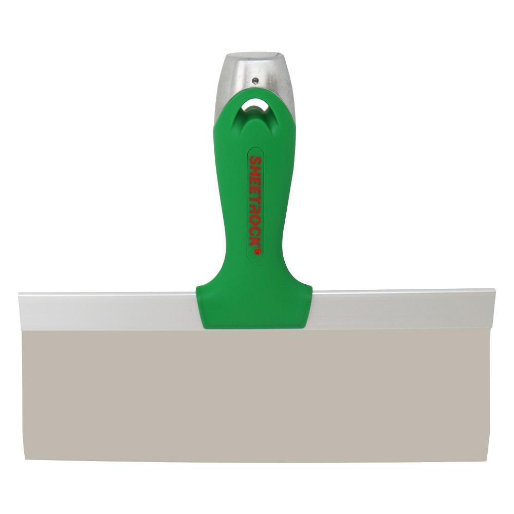 A single green leaf against a white background.