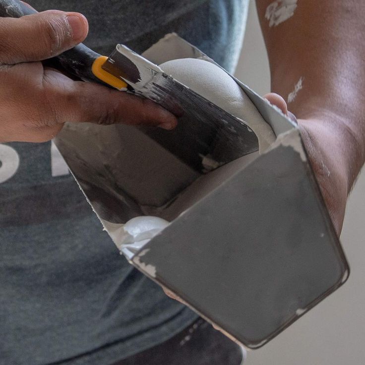 A single green leaf against a white background.