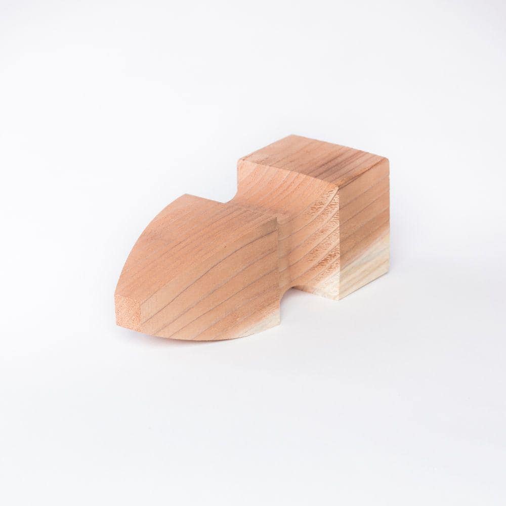 A single green leaf against a white background.